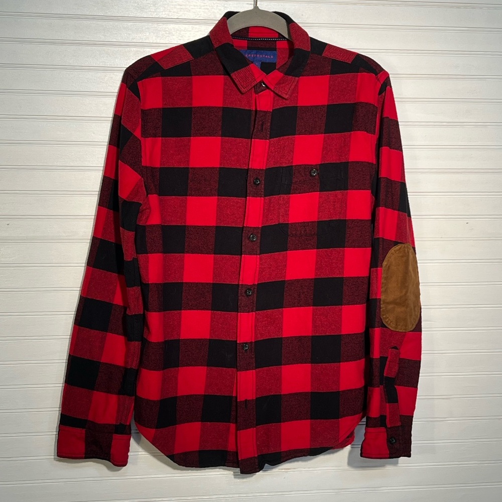 Red and Black Flannel with elbow patches.